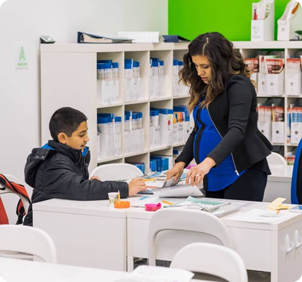 Teacher helping students